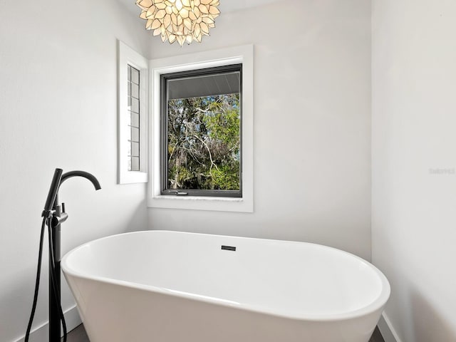 bathroom with a freestanding bath