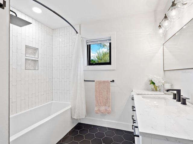 bathroom with recessed lighting, vanity, baseboards, tile patterned floors, and shower / bath combo