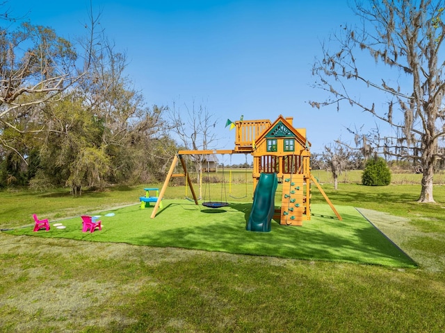 view of playground with a lawn