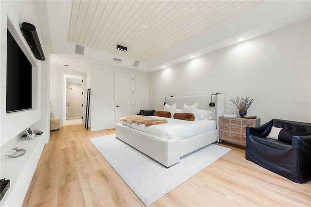 bedroom with visible vents, light wood-type flooring, wood ceiling, and recessed lighting