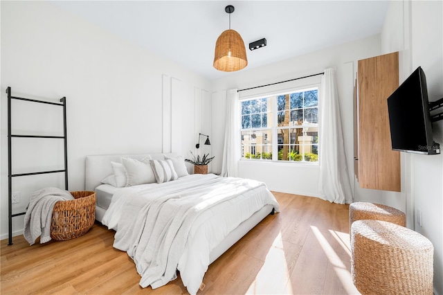 bedroom featuring light wood finished floors