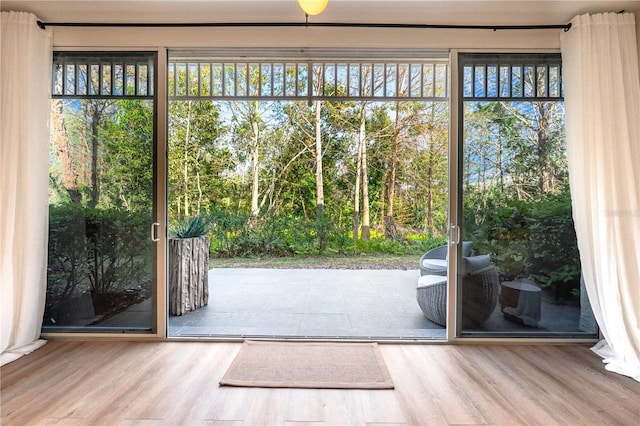 doorway to outside featuring wood finished floors