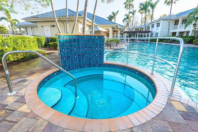 community pool featuring a community hot tub