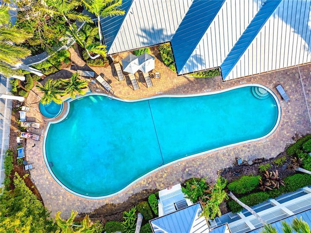 community pool with a patio area