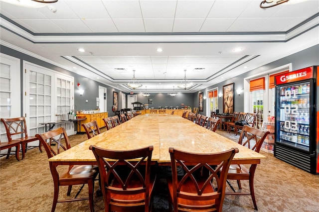 dining area featuring carpet floors, ornamental molding, and visible vents