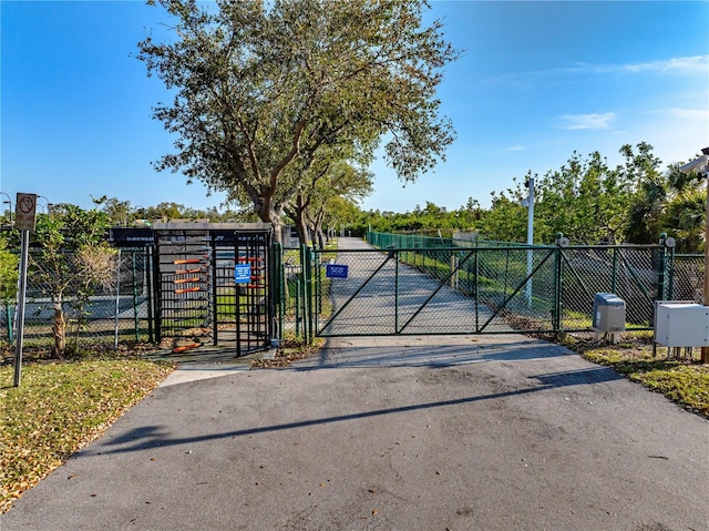 view of gate with fence