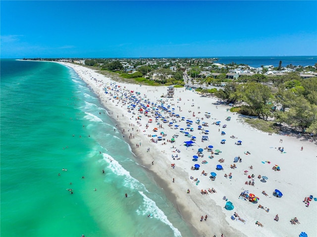 aerial view with a water view and a view of the beach