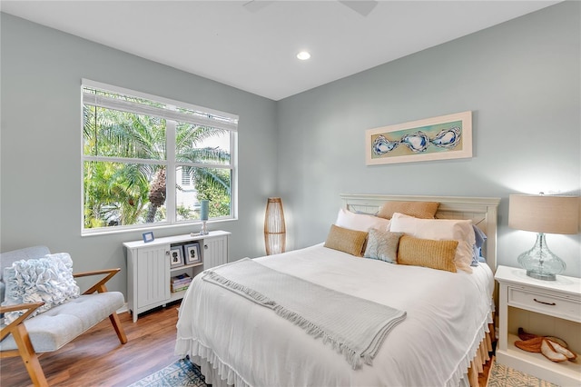 bedroom featuring light wood finished floors and recessed lighting