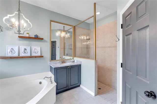 full bathroom featuring a walk in shower, a notable chandelier, vanity, a bath, and tile patterned floors