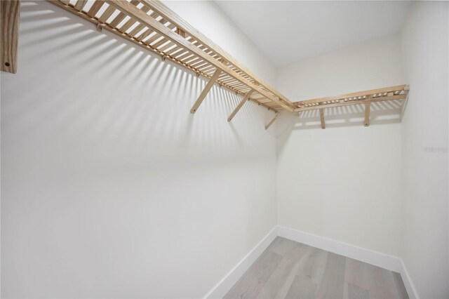 spacious closet with wood finished floors