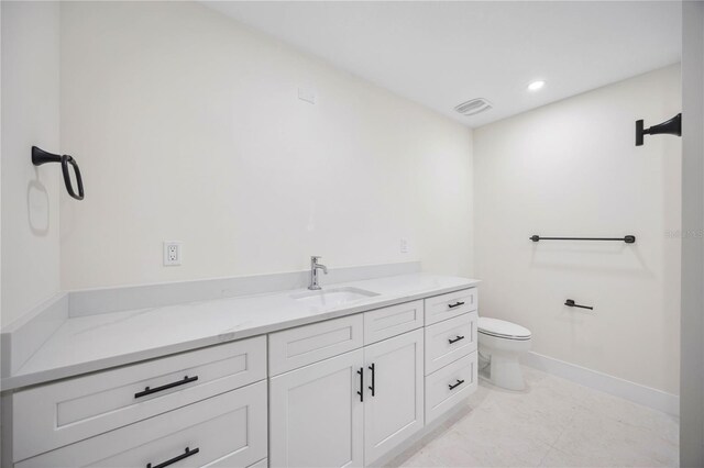 bathroom with vanity, baseboards, visible vents, recessed lighting, and toilet