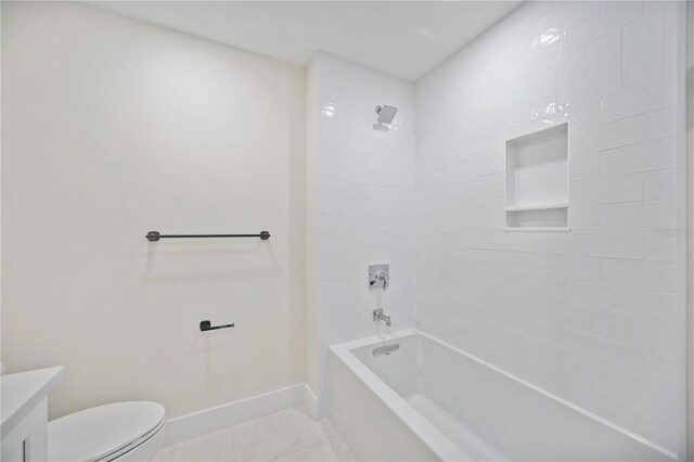 full bathroom with baseboards, toilet, vanity, and shower / bathtub combination