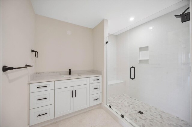 full bath featuring vanity, a shower stall, recessed lighting, and tile patterned floors