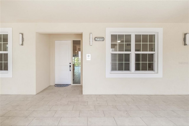 280 Hidden Bay Dr Unit 202, Osprey, FL 34229 - property entrance featuring stucco siding and a patio area