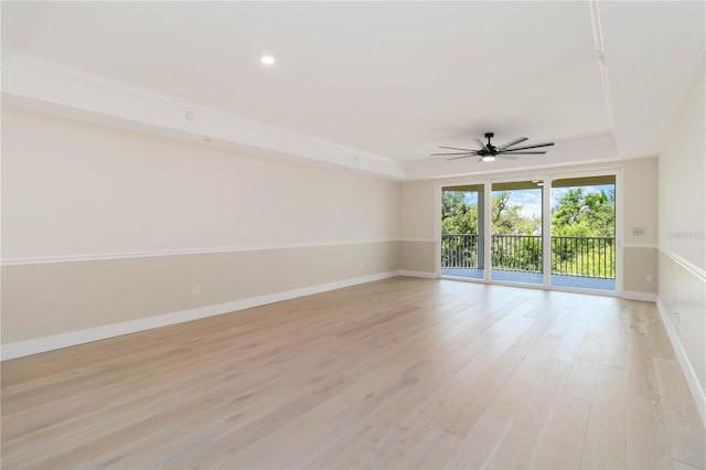 280 Hidden Bay Dr Unit 202, Osprey, FL 34229 - spare room featuring a tray ceiling, baseboards, ceiling fan, light wood-style floors, and recessed lighting