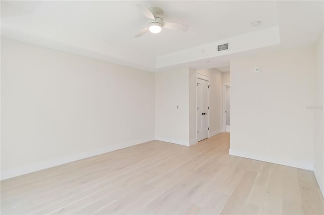 280 Hidden Bay Dr Unit 202, Osprey, FL 34229 - empty room featuring a ceiling fan, baseboards, and light wood-style floors