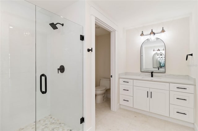 280 Hidden Bay Dr Unit 202, Osprey, FL 34229 - bathroom with a shower stall, toilet, vanity, and tile patterned flooring