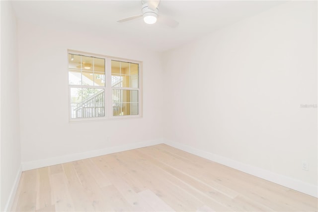 280 Hidden Bay Dr Unit 202, Osprey, FL 34229 - empty room featuring wood finished floors, baseboards, and a ceiling fan