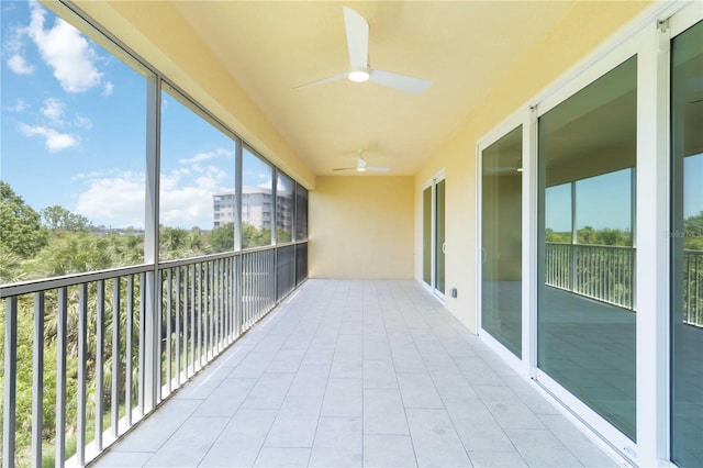 280 Hidden Bay Dr Unit 202, Osprey, FL 34229 - unfurnished sunroom featuring a ceiling fan
