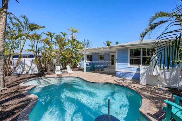 view of swimming pool with a patio area, a fenced in pool, a pergola, and fence