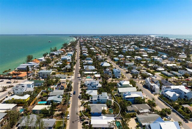 bird's eye view with a residential view and a water view