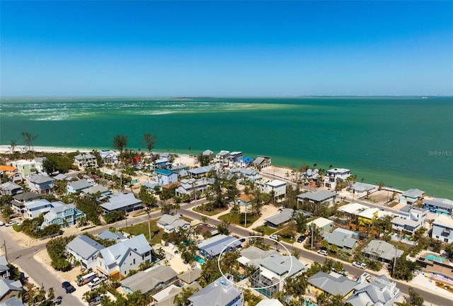 birds eye view of property featuring a water view and a residential view