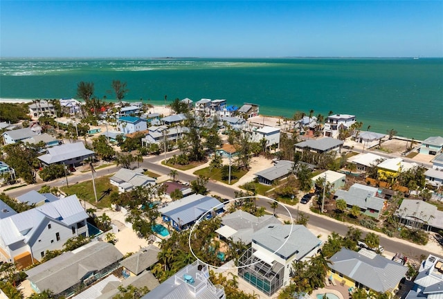 bird's eye view with a residential view and a water view