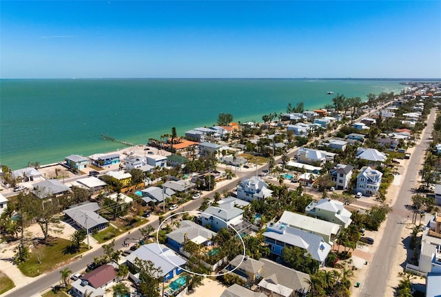 drone / aerial view with a residential view and a water view