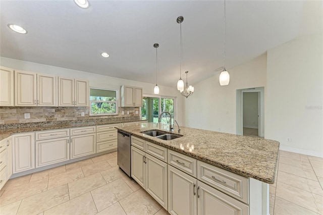 kitchen featuring cream cabinetry, decorative backsplash, vaulted ceiling, a sink, and dishwasher