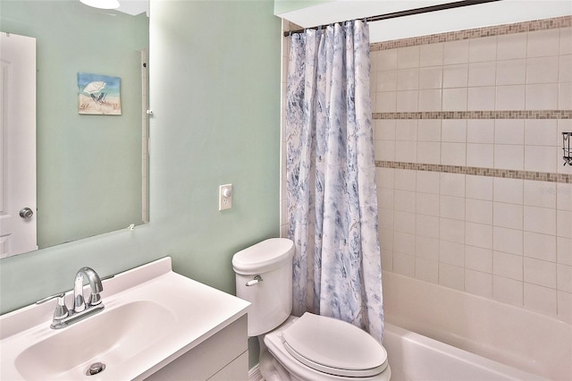 bathroom with toilet, shower / bath combo with shower curtain, and vanity