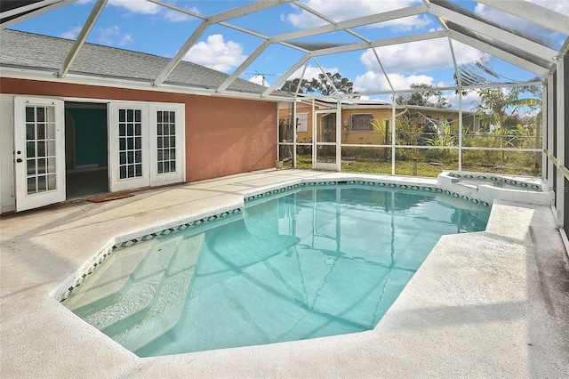 pool featuring a lanai and a patio area