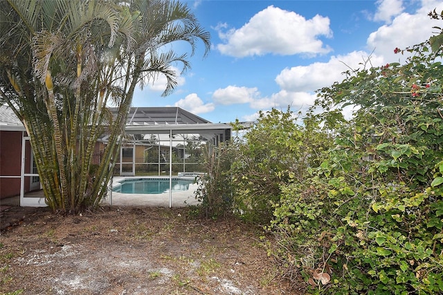 pool with a patio area and a lanai