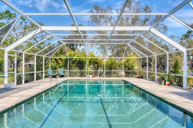 pool featuring a lanai and a patio