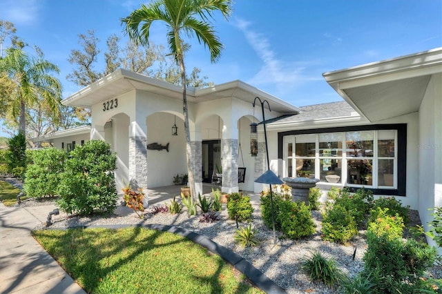 view of front of home featuring stucco siding