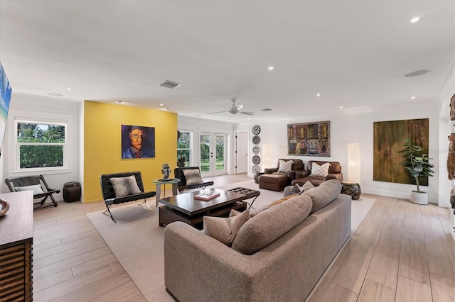 living area featuring ceiling fan, light wood finished floors, visible vents, and recessed lighting