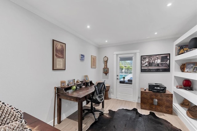 office space featuring baseboards, ornamental molding, recessed lighting, and light wood-style floors