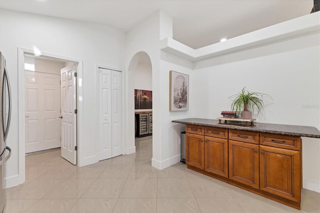 bar with arched walkways and baseboards