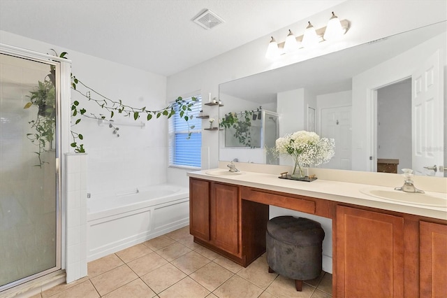 full bath featuring double vanity, tile patterned flooring, a sink, and visible vents