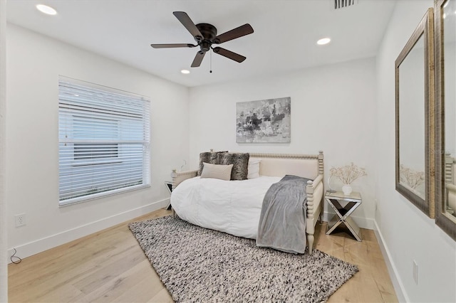 bedroom featuring visible vents, baseboards, ceiling fan, light wood-type flooring, and recessed lighting