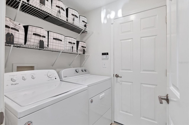 washroom featuring laundry area and washer and clothes dryer