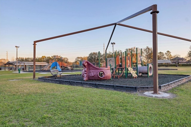 communal playground featuring a yard