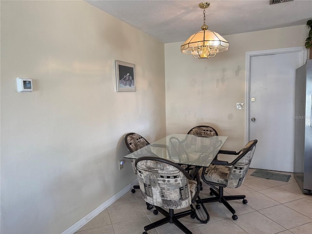 dining room with a chandelier, visible vents, baseboards, and light tile patterned floors