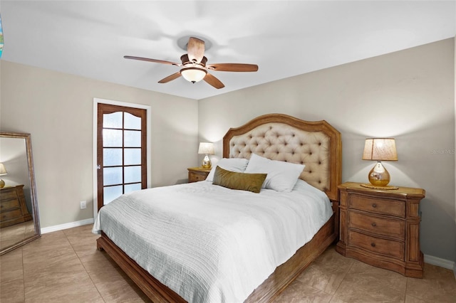 bedroom with a ceiling fan and baseboards