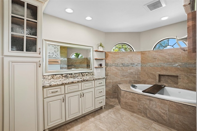 full bath with recessed lighting, visible vents, a garden tub, and vanity