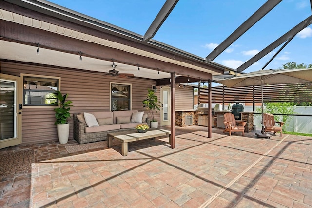 view of patio with a lanai, ceiling fan, an outdoor hangout area, and area for grilling