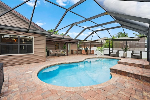 outdoor pool featuring a lanai, outdoor lounge area, and a patio