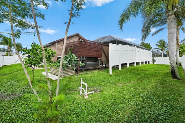 view of yard with a fenced backyard