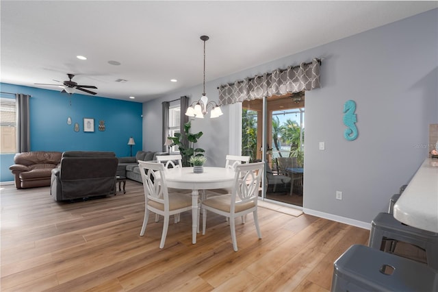 dining space featuring a wealth of natural light, recessed lighting, light wood finished floors, and baseboards