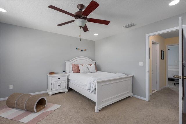 bedroom with visible vents, baseboards, ceiling fan, light carpet, and recessed lighting