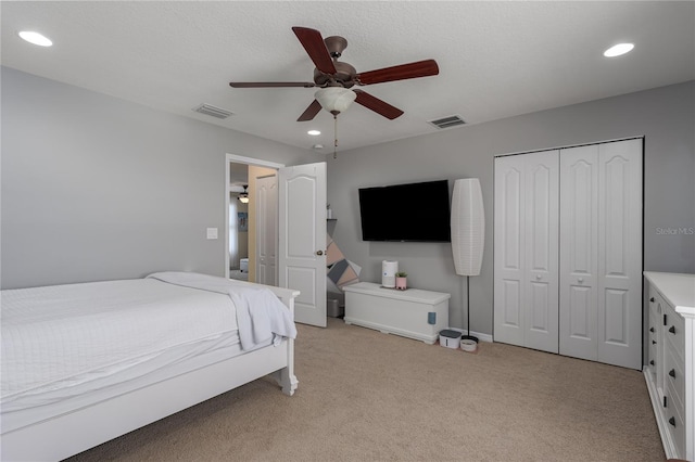 bedroom featuring recessed lighting, visible vents, and light colored carpet